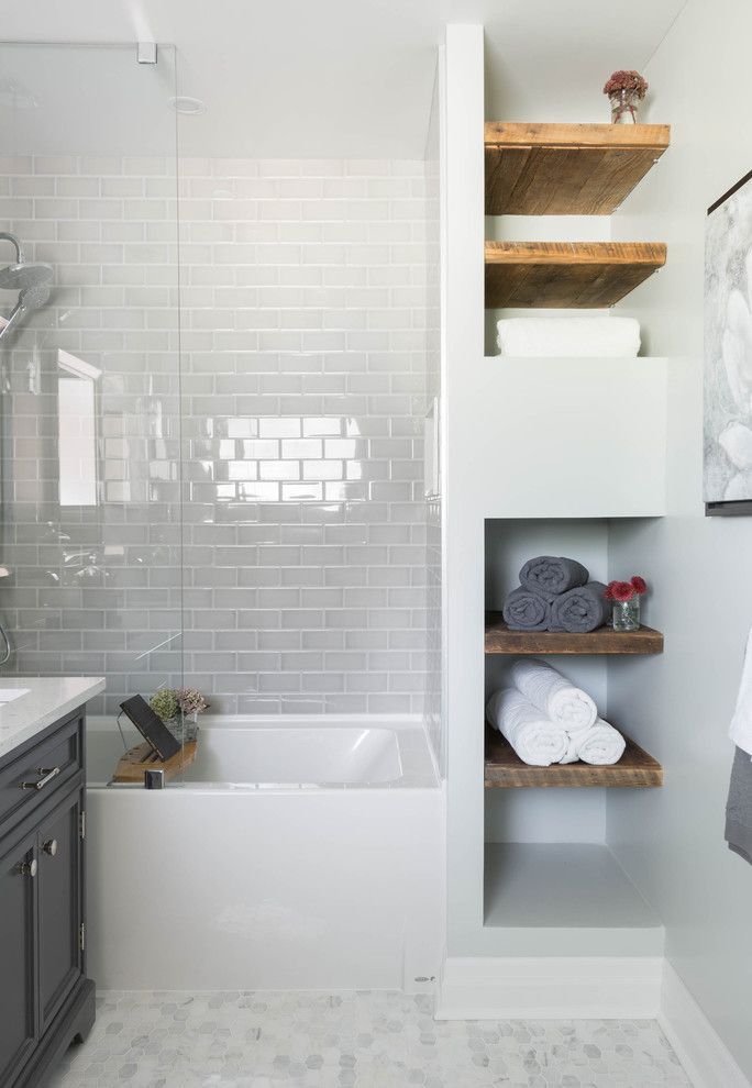 Bathroom, white subway tile, mosaic floor tile, glass shower tub, wood shelving |