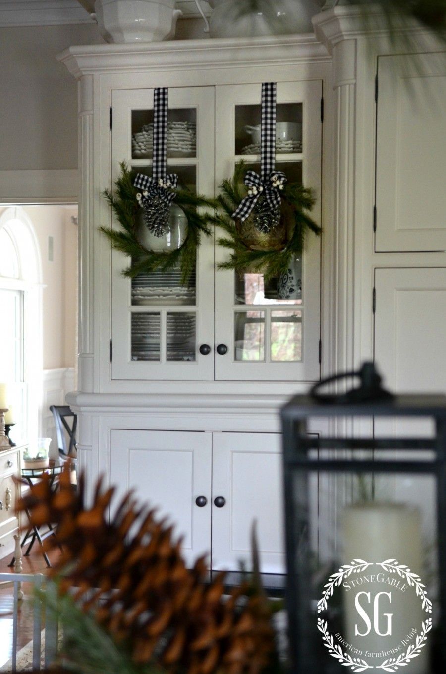 CHRISTMAS FARMHOUSE KITCHEN-pine wreaths-glass cabinets-stonegab…