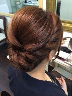 Elegant, polished, braided updo that would be perfect for any bridesmaid or bridal