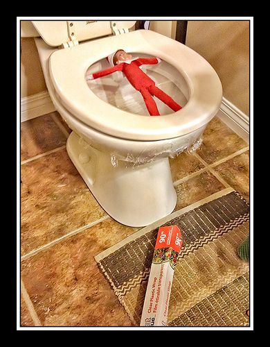 Elf on the Shelf playing in the bathroom