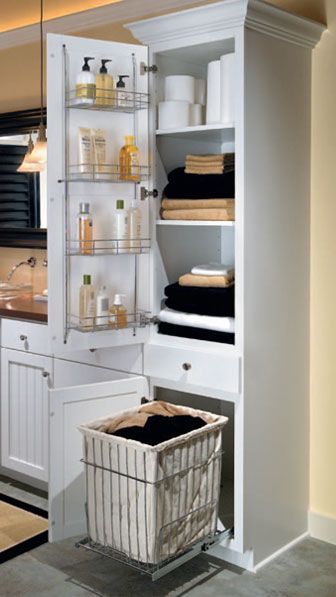 linen closet with removable hamper. probably wanna do this in the linen closet on