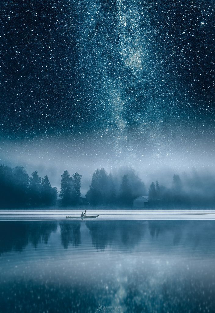Milky way over the misty Vanajavesi lake in Hameenlinna, Finland