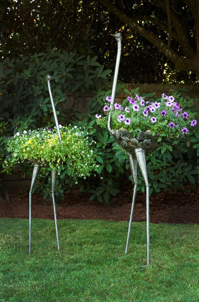 These creative ostrich plant holders are designed to showcase flowers artfully, as
