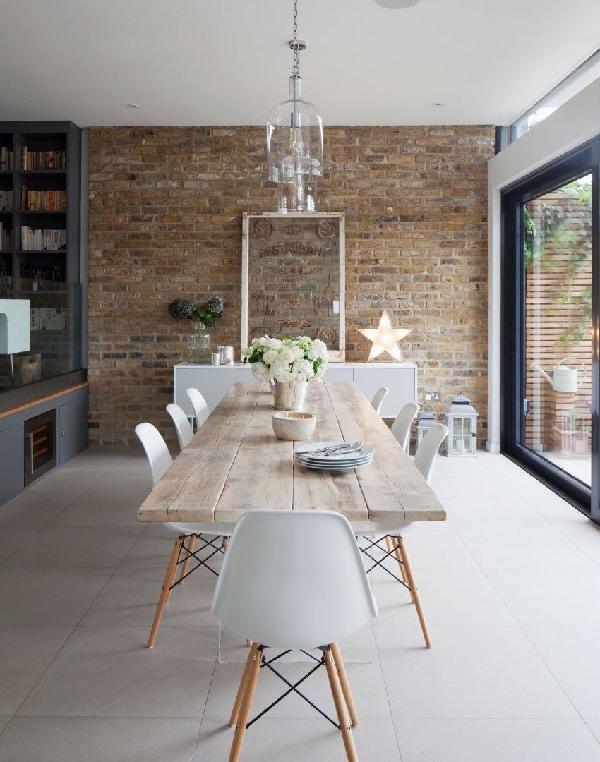 White Scandi-style Dining Room with Exposed Brick Wall