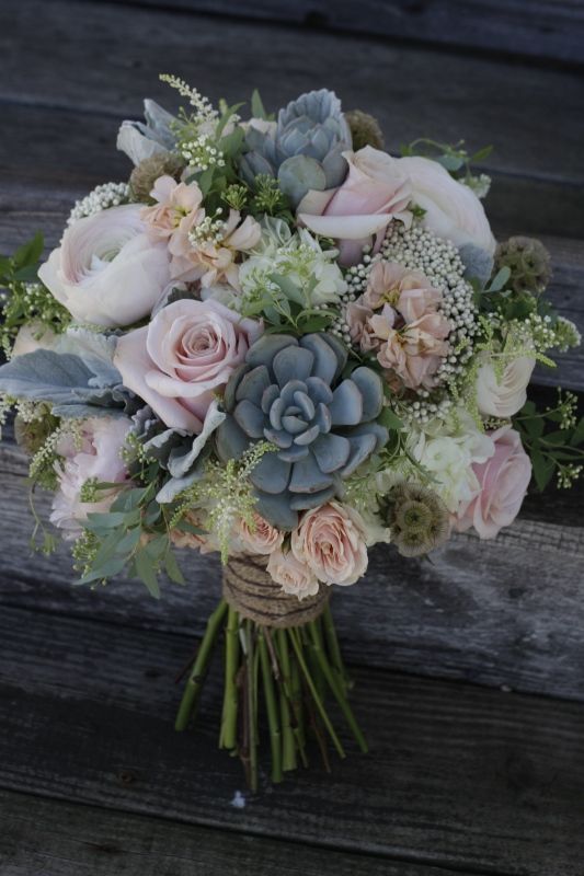 A shabby chic bridal bouquet featuring succulents, dusty pink roses and peonies fo