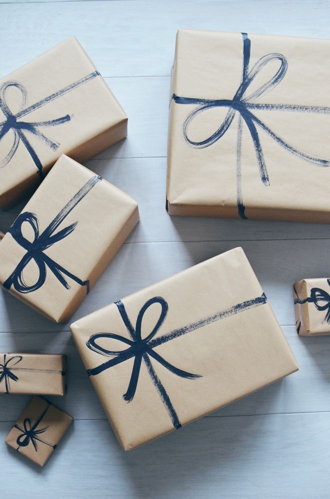 brown paper packages with painted on string | caries