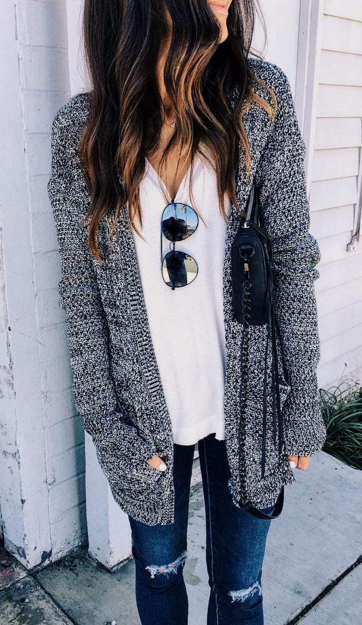 long gray knit sweater with a white tee