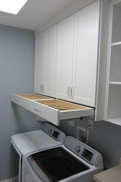 OMG! I love that drying rack drawer!! Laundry Room Cabinet Ideas | Get Laundry Roo