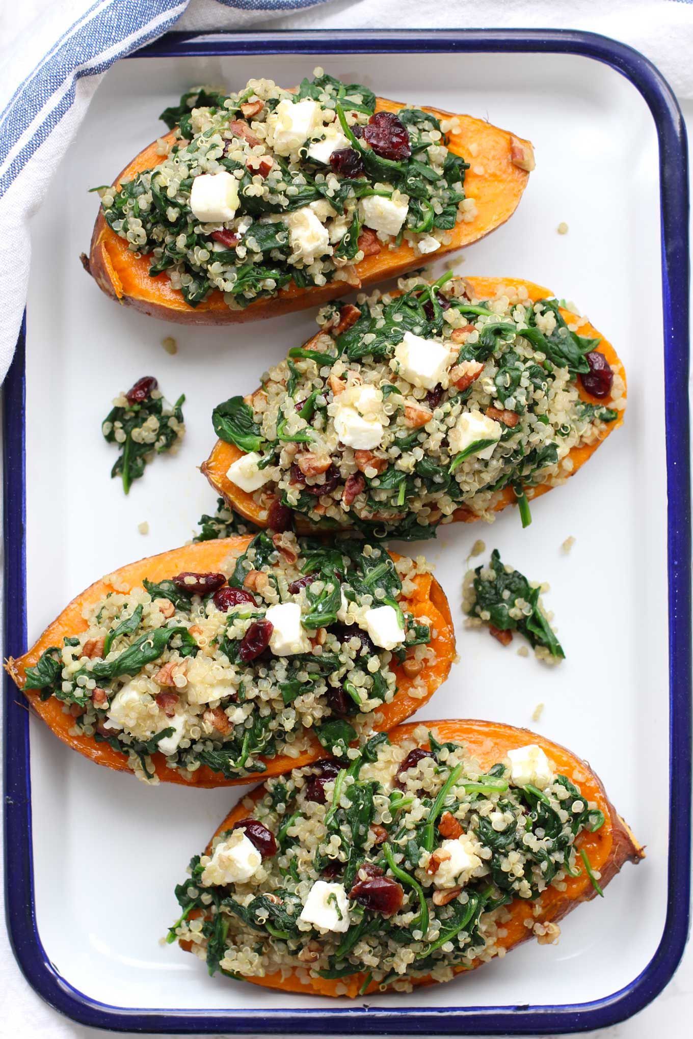 Roasted sweet potatoes stuffed with quinoa and spinach are a favorite fall dish. I