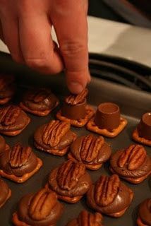 Rolo Turtles: So easy! Cover baking sheet with foil, top each pretzel with a rolo,