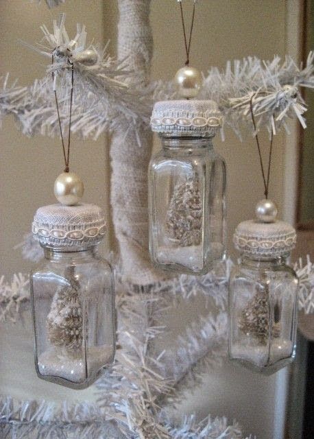 Snow globe ornaments made from salt and pepper shakers.