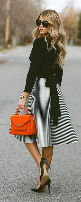 Spring fashion | Striped midi dress, black shirt and heels with orange tote bag