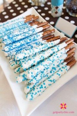 Chocolate Dipped Pretzels  Dip pretzels in white chocolate and blue sprinkles. Als