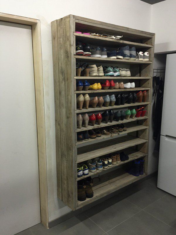 Giant Shoe Rack Made Out Of Discarded Pallets — but think in terms of canning and food storage!