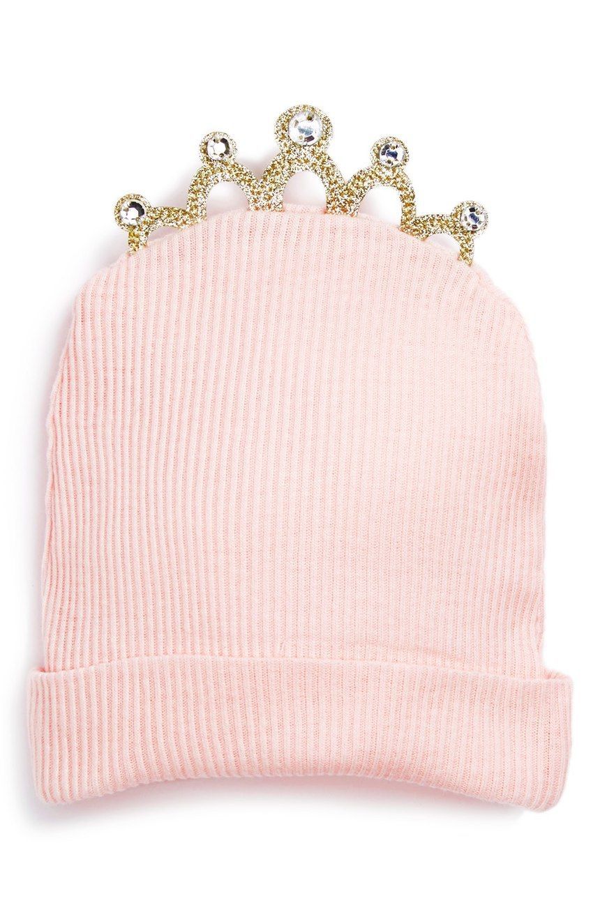 The little one will be cute as can be in this charming pink knit cap crowned by a sparkly tiara.