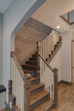 The New Craftsman contemporary staircase and planked wall.