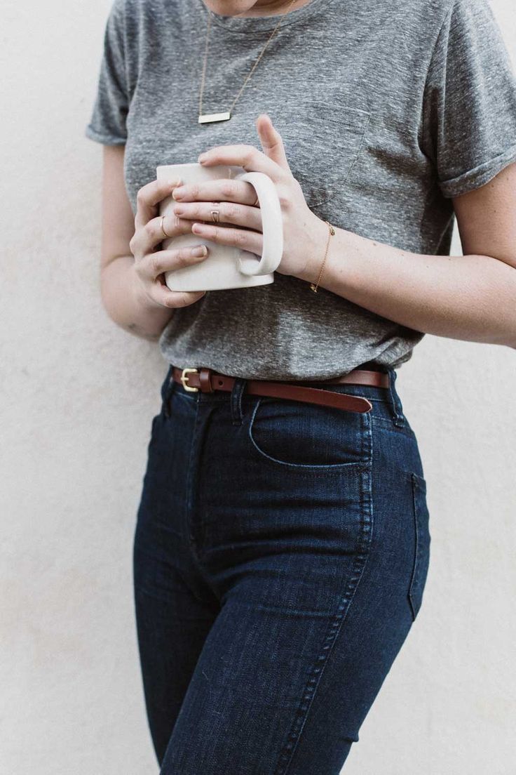 A classic and simple look can never go wrong. The high wasted jeans with the belt, simple piece of jewelry ALL complement each