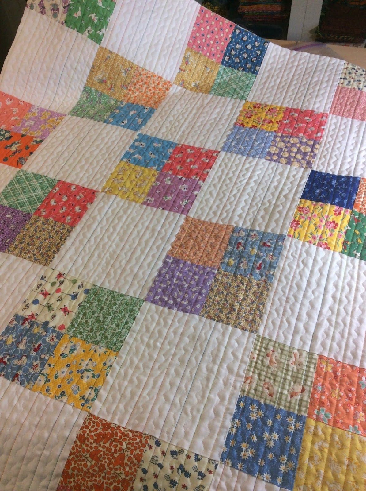 A pretty quilt made for charity.  Love the quilt stitching!  | Mama Sparks World