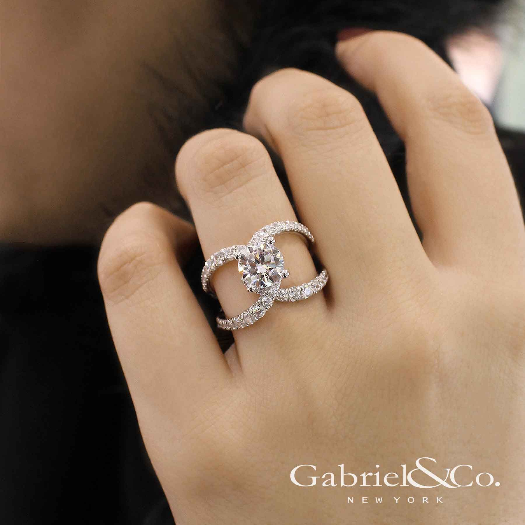 Gabriel & Co. – Voted #1 Most Preferred Bridal Brand.   A brightly, unique split shank band complements the classic round diamond