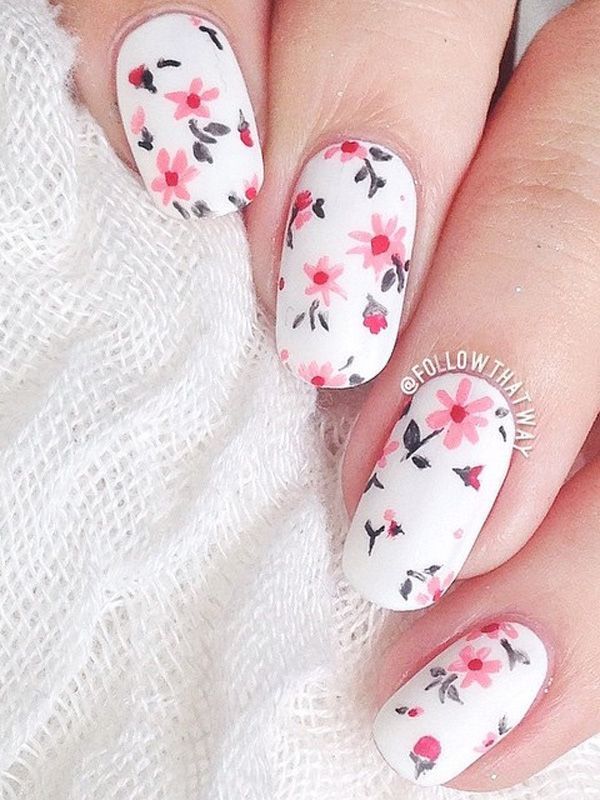 Give your nails a bright spring feel with this flower inspired nail art design. The falling pink flowers look perfect against the