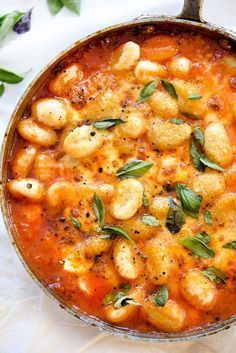 This simple tomato sauce gets tons of flavor from herbs steeped in olive oil that lusciously coats potato pillows of gnocchi.
