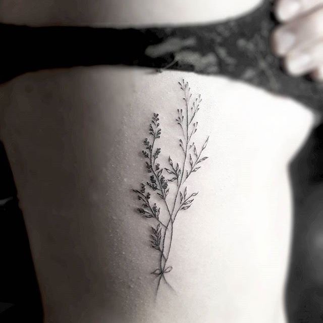 Wildflower rib tattoo