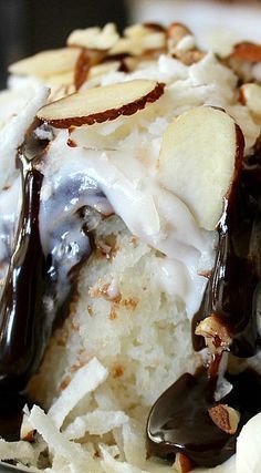 Almond Joy Poke Cake – Easy only 4 ingredients – One Box of White Cake Mix One jar of Hot Fudge Topping One container of White