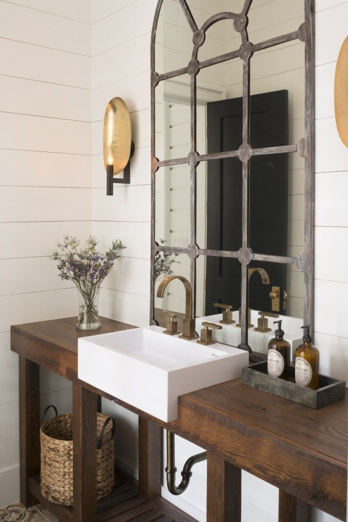 Love the use of the vintage warehouse window frame mirror. Back Row imports many items like this for repurposing.