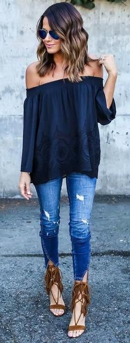 Navy off the shoulder top, jeans and sandals.