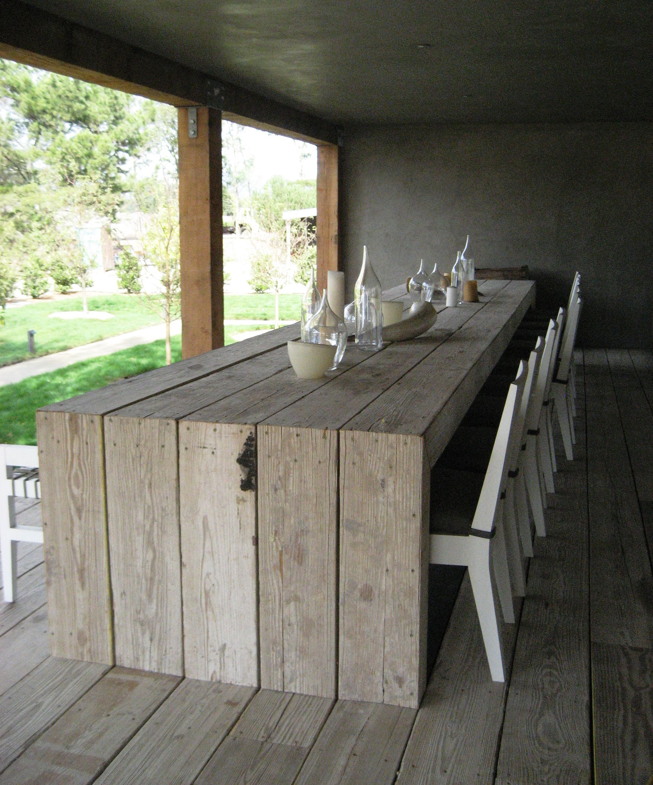 the table is made from a pallet – buy the white plastic chairs and white centre…