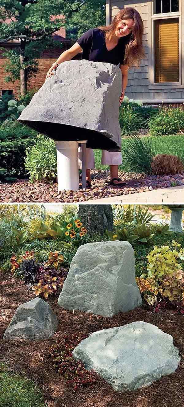 #10. Faux giant stone to hide the ugly stuff in the garden.
