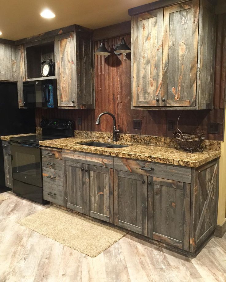 A little barnwood kitchen cabinets and corrugated steel backsplash. Love how…