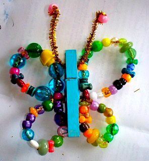 all it takes is some pipe cleaners, beads and a clothes pin and you got a butterfly