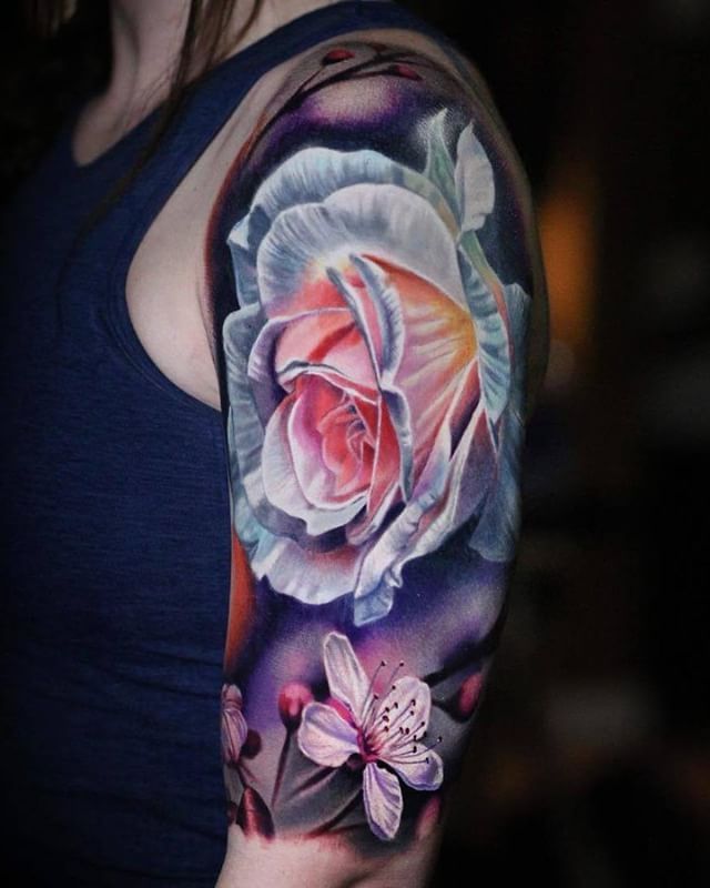 Bright & bold colorwork in this flower half sleeve
