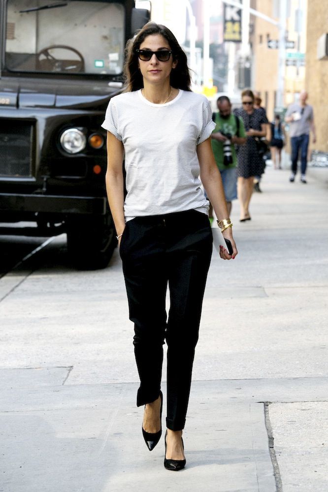 Capucine Safyurtlu in black trousers and a white t shirt