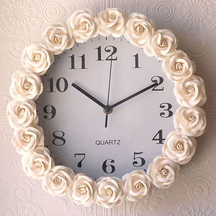 Cream Rose Wall Clock. or you can just DIY and buy little rosettes at a craft store, a cheap clock, and hot glue the little