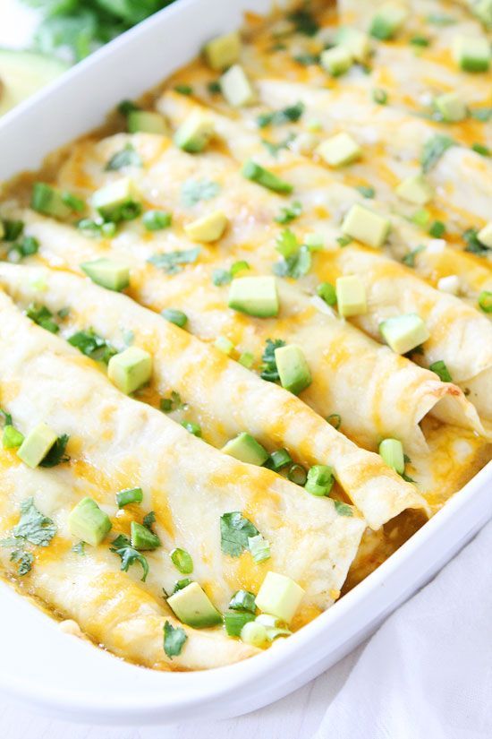 Creamy Spinach and Cheese Green Chile Enchiladas Recipe on twopeasandtheirpod.com Great for dinner recipe and they freeze well