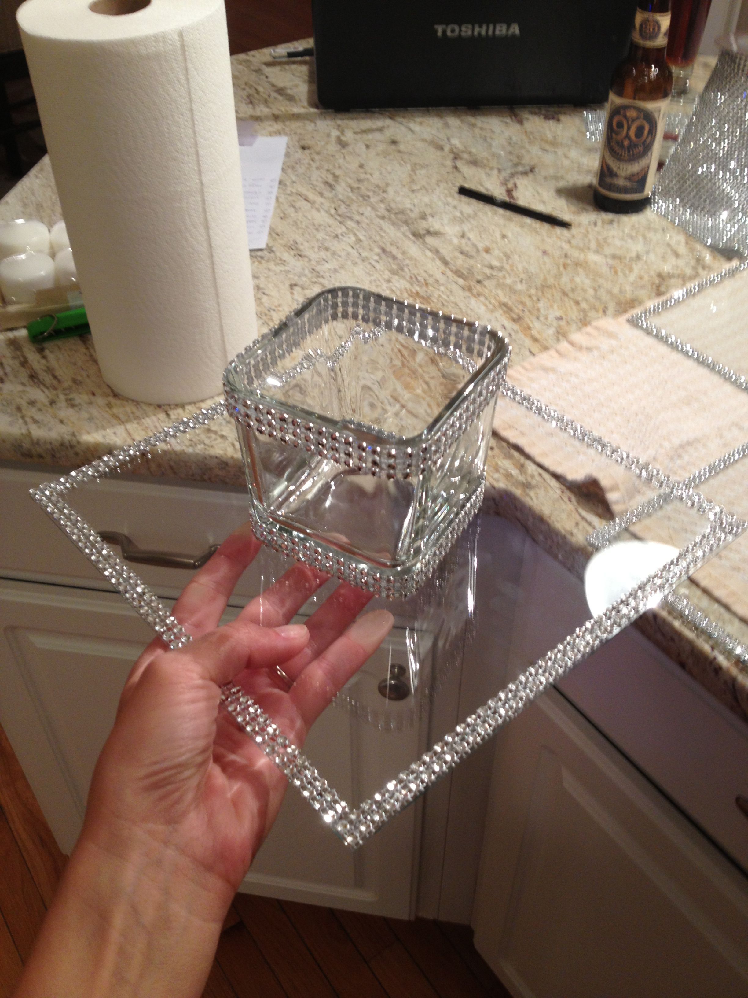 Dollar tree crafts – clear glass from pic frame and votive candle holder line with rhinestone ribbon from Michaels!