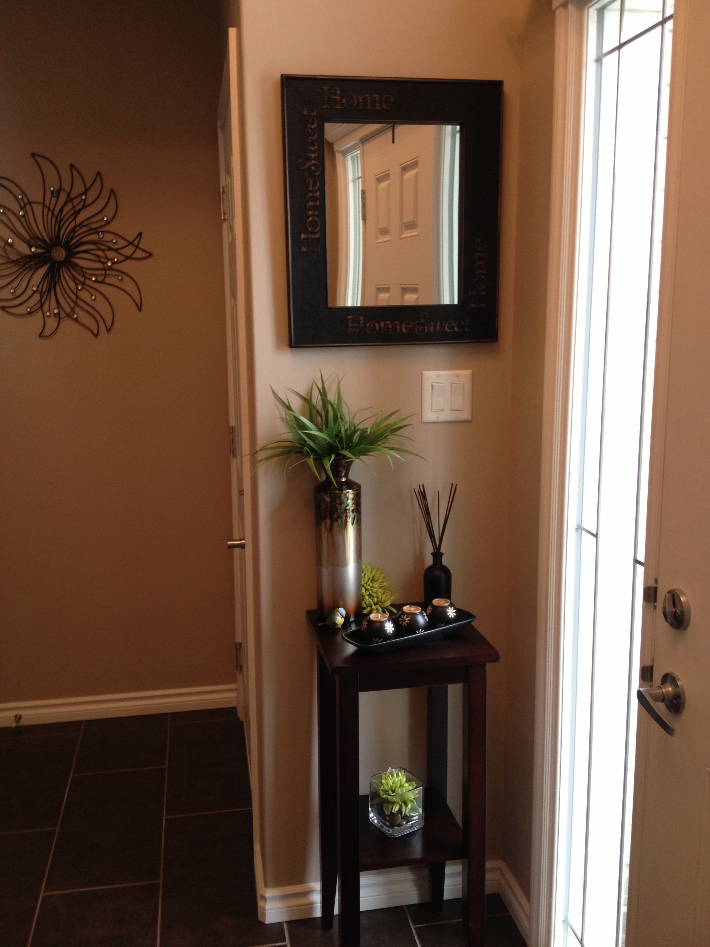 Entryway decor for small space. Like the idea of a small table, not this decor.  Like the organization of this.