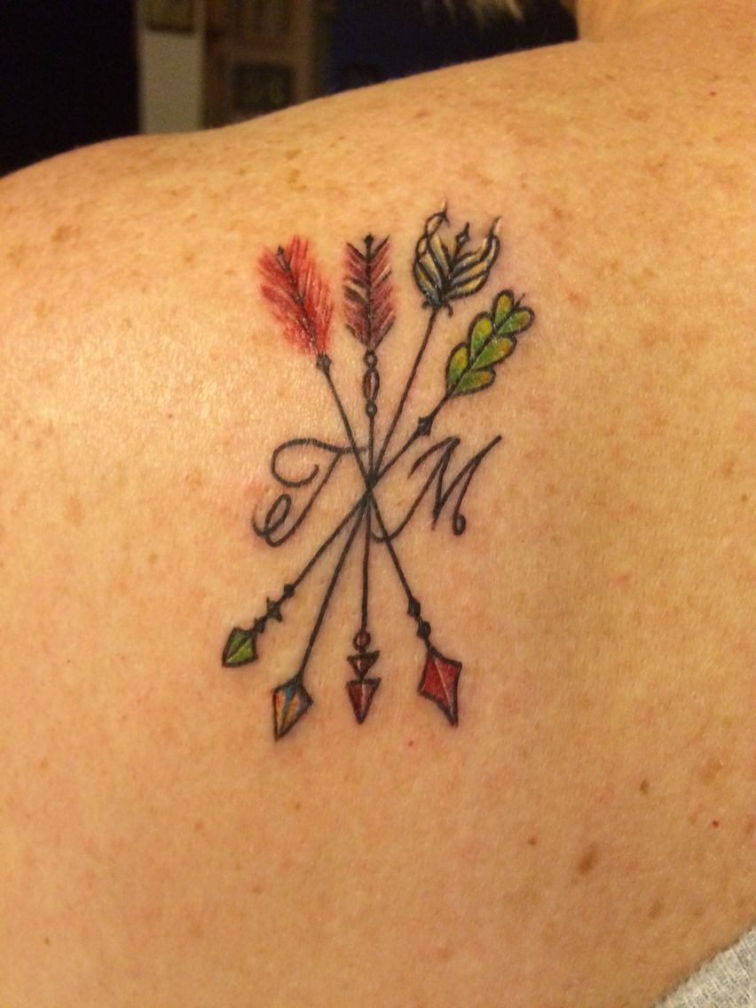 Family tattoo. Each arrow represents my children with their birthstones as the head and tail. The initials belong to my husband
