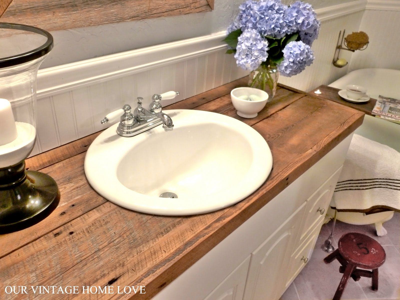 Hate your countertops?  DIY salvaged wood counter…cheap and so much more awesome than tile (for me at least) ;)