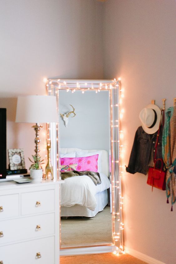 How cute is this!! A super easy way to brighten up any drab dorm room. Just drape the christmas lights around the mirror, and