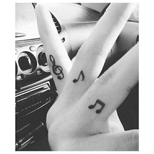I love these between-the-finger tattoos, so pretty. // music tat tats tattoos tattoo notes musician musical musicians musicals ink