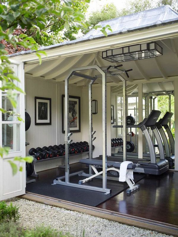 I want this!  Outdoor “garage” gym with really cool door for feeling like youre working out outside