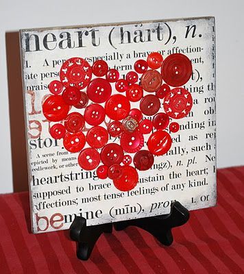 it is scrapbook paper on tile with a button heart on top! minus the buttons and possibly multiple ones on the wall for art?