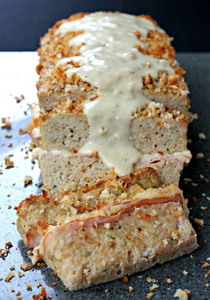 Layers of ham and swiss cheese inside a juicy chicken meatloaf-covered with creamy dijon gravy.