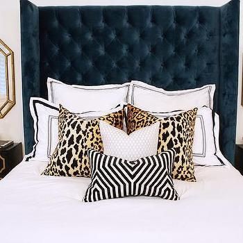 Navy Blue Wingback Bed with Leopard Pillows