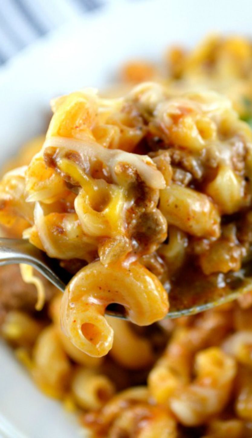 One Skillet Cheesy Chili Mac….Delicious, cheesy and gooey. Perfectly cooked pasta, meaty chili loaded with cheese all made
