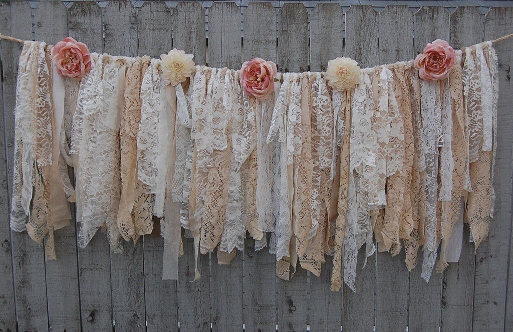 Shabby chic garland, hand tied with tattered tea stained and ivory lace, crepe, brocade and linen and accented with ivory and soft