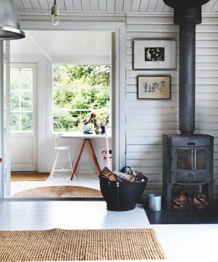 Simple, rustic summer house, cottage.  horizontal, painted plank walls.  Denmark.